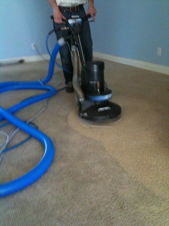 Eco-Dry Carpet Care cleaning a bedroom carpet